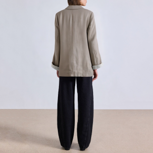 Women's suit jacket with padded shoulders and rolled sleeves